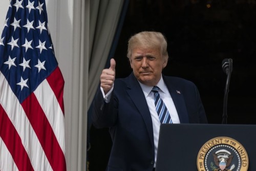 President Donald Trump gives thumbs up, as he departs after speaking from the Blue Room Balcony of the White House to a crowd of supporters, Saturday, Oct. 10, 2020, in Washington. (AP Photo/Alex Brandon)