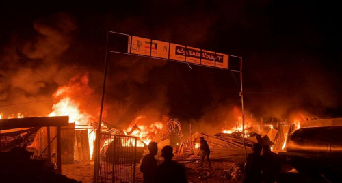 Fire rages following an Israeli strike on an area designated for displaced Palestinians, amid the ongoing conflict between Israel and Hamas, in Rafah in the southern Gaza Strip, in this still picture taken from a video, May 26, 2024. REUTERS/Reuters TV     TPX IMAGES OF THE DAY