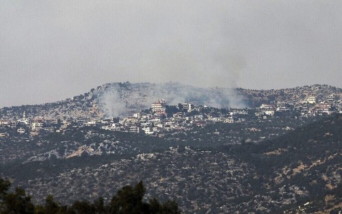 A picture taken from the Israeli side of the Blue Line that separates Israel and Lebanon shows smoke billowing above the Shebaa village sector in southern Lebanon, after reports of clashes in the border area, on July 27, 2020. (Photo by Jalaa MAREY / AFP)