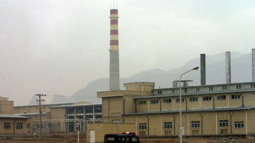 FILE PHOTO: A security car passes in front of the Natanz nuclear facility 300 km south of Tehran, November 20, 2004./File Photo